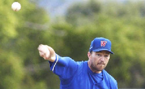 Troy Pruess pitching for Workers in the preliminary final against Easts Redbirds last Saturday. Redbirds marched into the grand finalwith a 2-0 series win. Troy Pruess pitching for Workers in the preliminary final against Easts Redbirds last Saturday. Redbirds marched into the grand finalwith a 2-0 series win.
